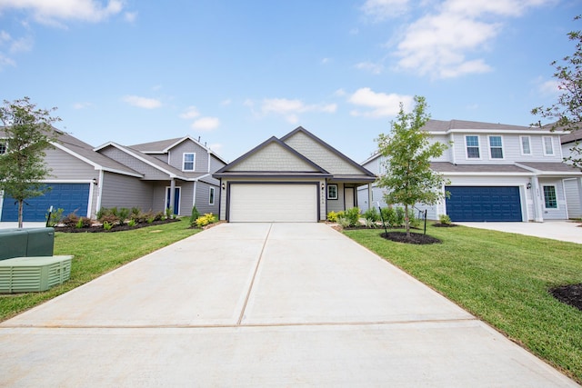 2569 Hawks Eye Dr, Conroe, TX 77301 - view of front of house with a front yard, driveway, and a garage