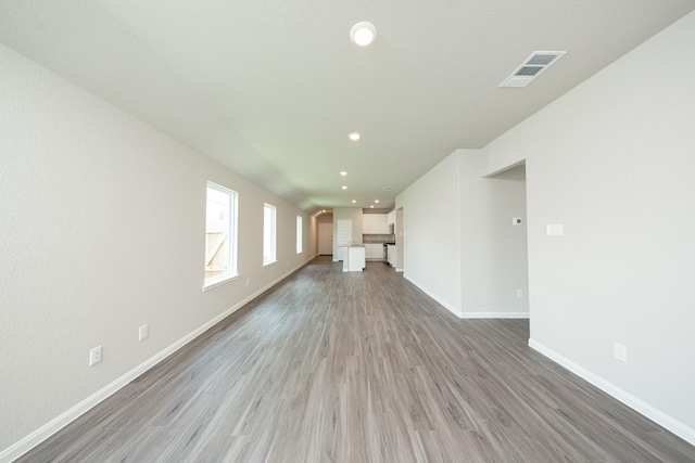 2569 Hawks Eye Dr, Conroe, TX 77301 - unfurnished living room featuring light wood-style floors and recessed lighting