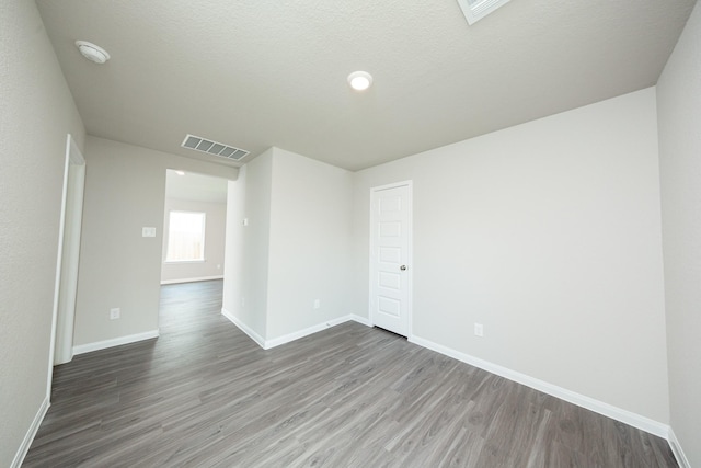 2569 Hawks Eye Dr, Conroe, TX 77301 - empty room with wood finished floors and a smoke detector