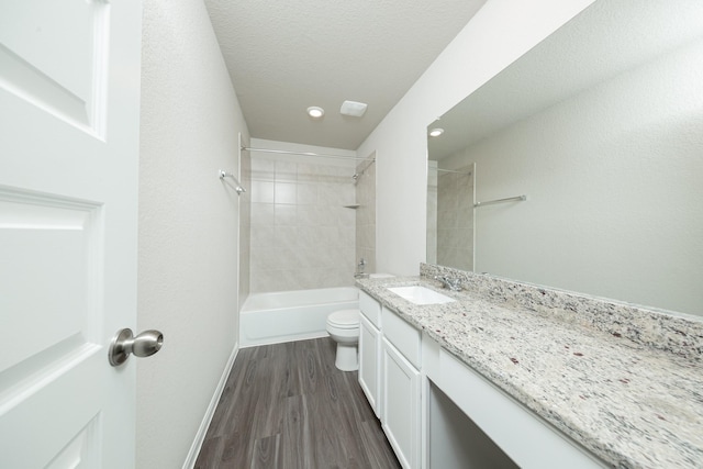 2569 Hawks Eye Dr, Conroe, TX 77301 - bathroom featuring vanity, wood finished floors, washtub / shower combination, and recessed lighting