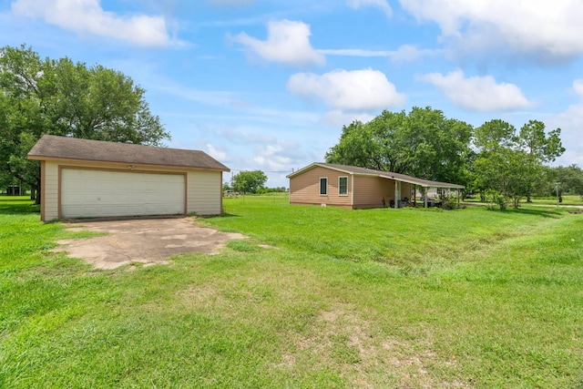 501 Carlson Cir, Wharton, TX 77488 - view of green lawn with an outbuilding and a detached garage