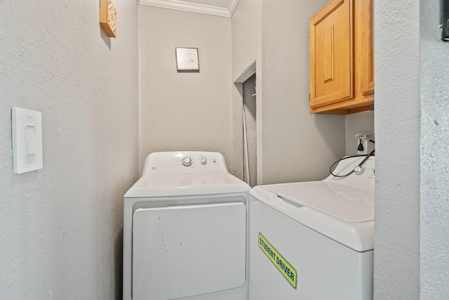 501 Carlson Cir, Wharton, TX 77488 - laundry area with cabinet space, washing machine and dryer, a textured wall, and crown molding