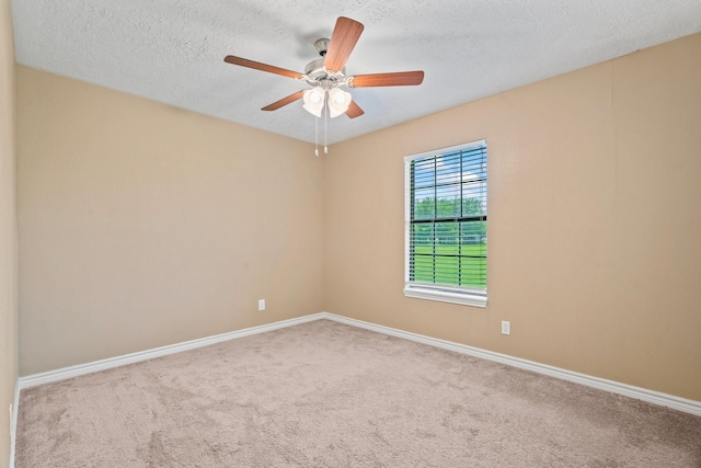 501 Carlson Cir, Wharton, TX 77488 - empty room featuring carpet flooring, a ceiling fan, and a textured ceiling