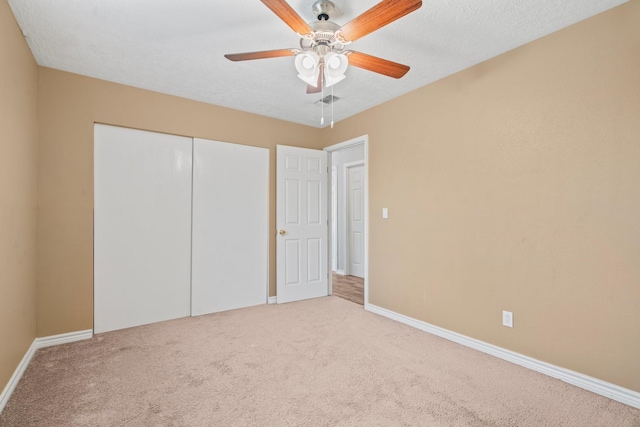 501 Carlson Cir, Wharton, TX 77488 - unfurnished bedroom with carpet floors, a closet, and ceiling fan