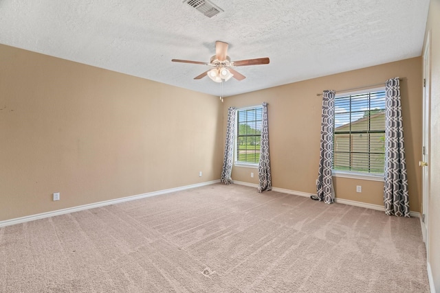 501 Carlson Cir, Wharton, TX 77488 - empty room with a ceiling fan, carpet flooring, and a textured ceiling