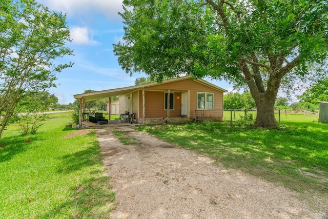 501 Carlson Cir, Wharton, TX 77488 - view of front of house with driveway and a carport