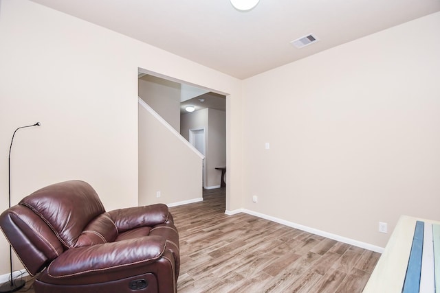 8218 Polaris Point Ln, Cypress, TX 77433 - sitting room featuring light wood-style floors and stairway