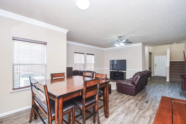 8218 Polaris Point Ln, Cypress, TX 77433 - dining room with a ceiling fan, stairway, light wood-style floors, and ornamental molding