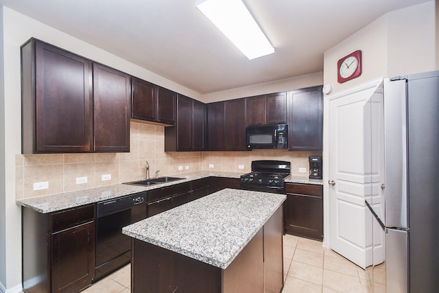 8218 Polaris Point Ln, Cypress, TX 77433 - kitchen featuring black appliances, light tile patterned flooring, backsplash, and a center island