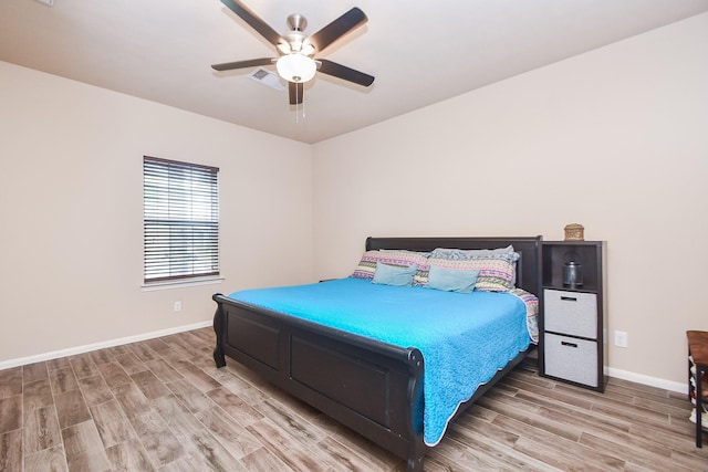 8218 Polaris Point Ln, Cypress, TX 77433 - bedroom featuring light wood-style floors and ceiling fan