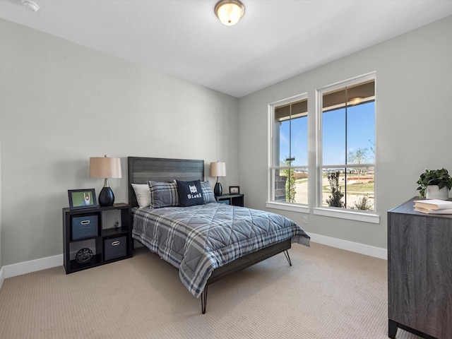 14316 Moonlit Creek Ct, Montgomery, TX 77316 - bedroom featuring light carpet and baseboards