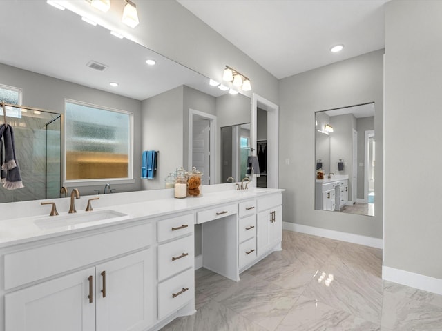 14316 Moonlit Creek Ct, Montgomery, TX 77316 - bathroom with double vanity, a stall shower, baseboards, marble finish flooring, and recessed lighting