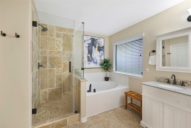 2818 Lake Forest Dr, Montgomery, TX 77356 - bathroom with a bath, a shower stall, vanity, and tile patterned flooring