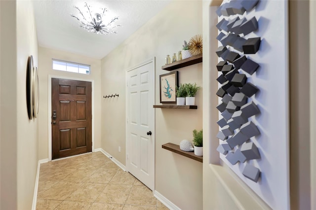 2818 Lake Forest Dr, Montgomery, TX 77356 - foyer entrance with a chandelier and light tile patterned floors