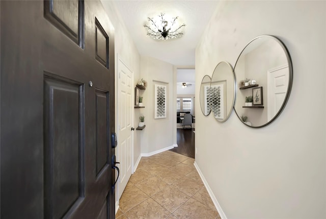 2818 Lake Forest Dr, Montgomery, TX 77356 - entrance foyer featuring light tile patterned floors and baseboards