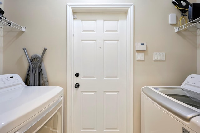 2818 Lake Forest Dr, Montgomery, TX 77356 - washroom with washing machine and dryer