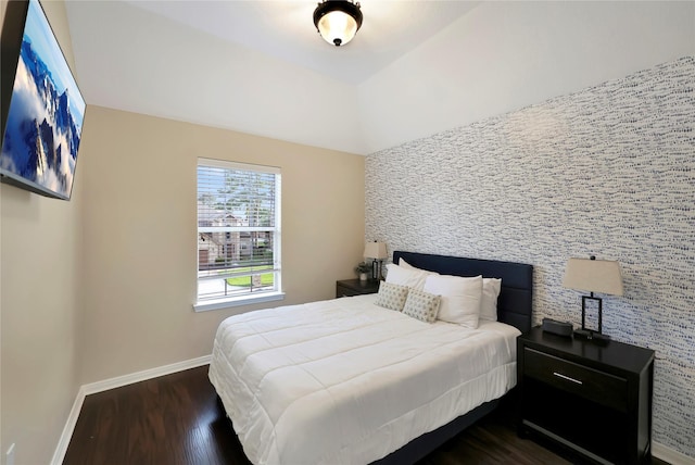 2818 Lake Forest Dr, Montgomery, TX 77356 - bedroom featuring dark wood finished floors and an accent wall