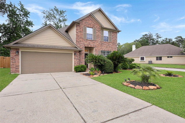 2818 Lake Forest Dr, Montgomery, TX 77356 - traditional-style house with brick siding, driveway, a front yard, and a garage