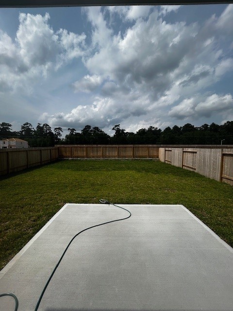 22919 Great Egret Dr, Splendora, TX 77372 - fenced backyard with a patio