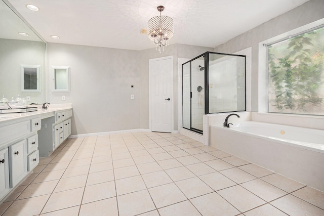 2128 Wimbleton Ct, Pearland, TX 77581 - full bath with vanity, a bath, a stall shower, tile patterned flooring, and a chandelier