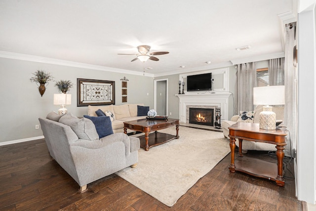 2128 Wimbleton Ct, Pearland, TX 77581 - living area with ceiling fan, a warm lit fireplace, dark wood-type flooring, and ornamental molding