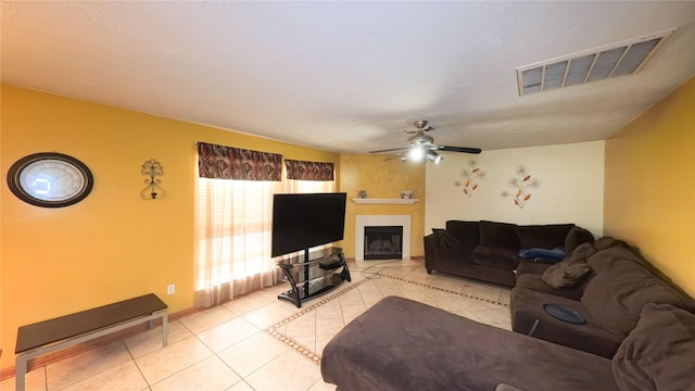 20930 Vista Trace Dr, Houston, TX 77073 - living room with a ceiling fan, light tile patterned floors, and a fireplace