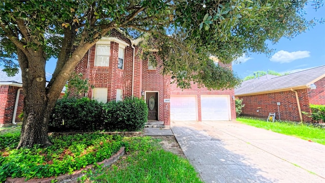 20930 Vista Trace Dr, Houston, TX 77073 - view of front of home featuring brick siding, concrete driveway, and a garage
