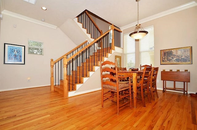 1331 W 21st St Unit A, Houston, TX 77008 - dining space with ornamental molding, stairs, light wood-type flooring, healthy amount of natural light, and recessed lighting