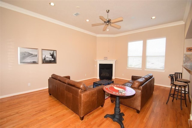 1331 W 21st St Unit A, Houston, TX 77008 - living room with a glass covered fireplace, light wood-style floors, a ceiling fan, crown molding, and recessed lighting