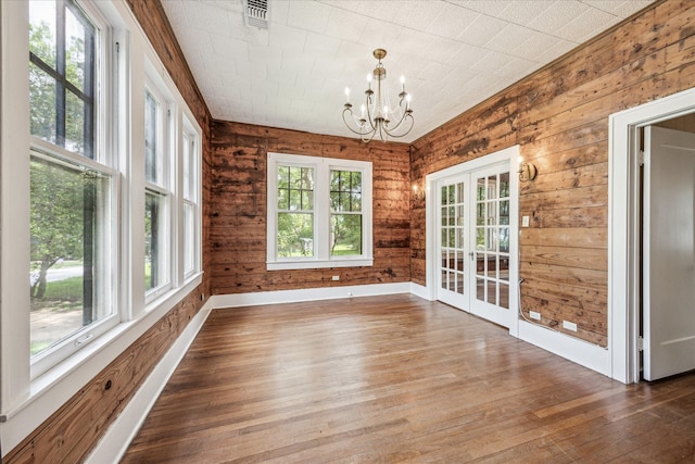 1407 S Baylor St, Brenham, TX 77833 - unfurnished sunroom featuring french doors and a chandelier