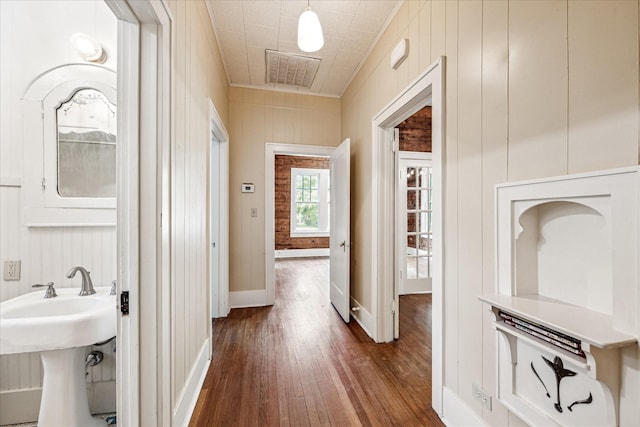 1407 S Baylor St, Brenham, TX 77833 - corridor featuring dark wood-type flooring and a sink
