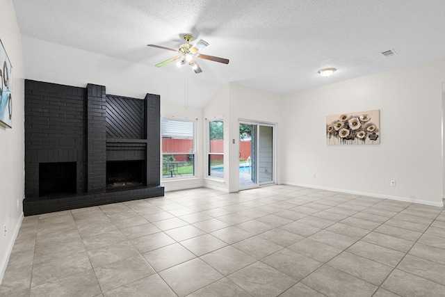 9803 Haverdown Dr, Houston, TX 77065 - unfurnished living room with a ceiling fan, vaulted ceiling, tile patterned floors, a textured ceiling, and a brick fireplace