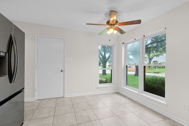 9803 Haverdown Dr, Houston, TX 77065 - unfurnished room with ceiling fan and light tile patterned flooring