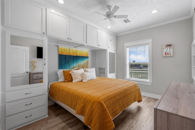 1790 Catfish Ln, Crystal Beach, TX 77650 - bedroom with ornamental molding, light wood finished floors, recessed lighting, and a ceiling fan