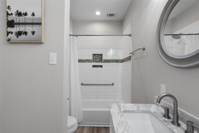 1790 Catfish Ln, Crystal Beach, TX 77650 - bathroom featuring shower / bath combo with shower curtain, wood finished floors, and vanity