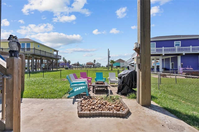 1790 Catfish Ln, Crystal Beach, TX 77650 - view of patio / terrace with a fire pit, a grill, and a residential view