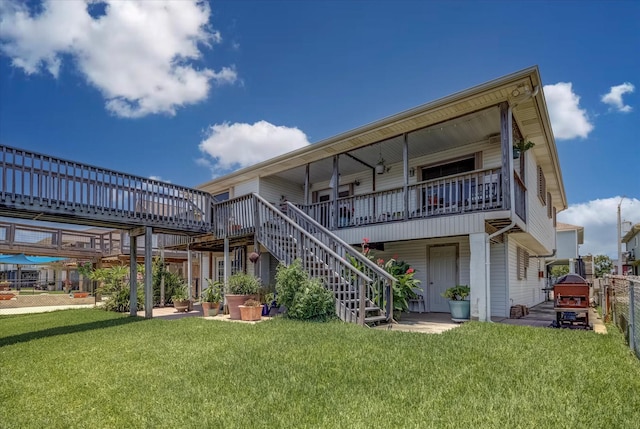 1120 Redfish St, Bayou Vista, TX 77563 - back of house with stairway and a wooden deck