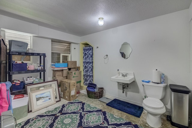 1120 Redfish St, Bayou Vista, TX 77563 - bathroom featuring toilet and a textured ceiling