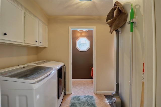 16322 Clearcrest Dr, Houston, TX 77059 - washroom featuring washer and dryer, cabinet space, and light tile patterned floors