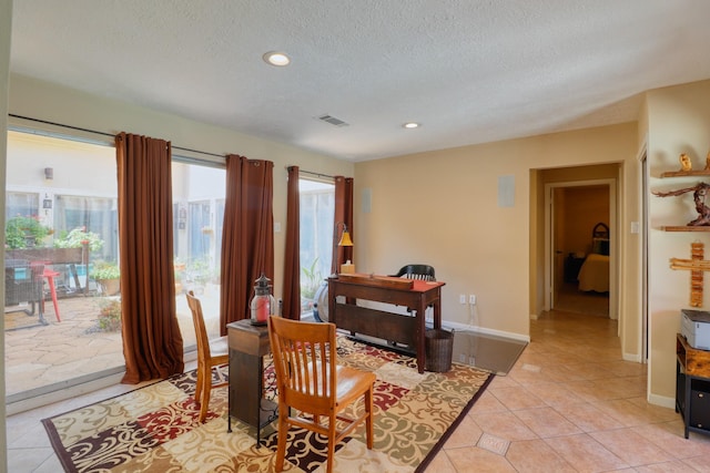 16322 Clearcrest Dr, Houston, TX 77059 - dining area with a textured ceiling, light tile patterned floors, and recessed lighting