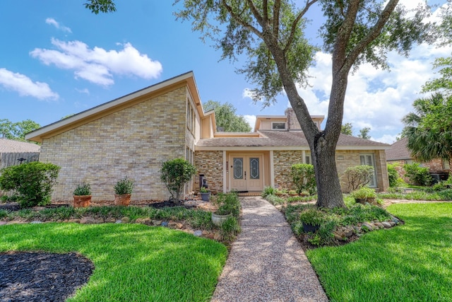16322 Clearcrest Dr, Houston, TX 77059 - mid-century home featuring a front yard, french doors, and stone siding