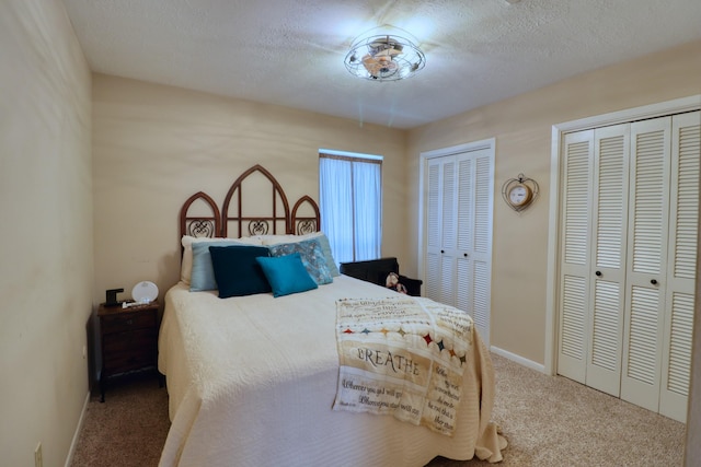 16322 Clearcrest Dr, Houston, TX 77059 - carpeted bedroom featuring multiple closets and a textured ceiling