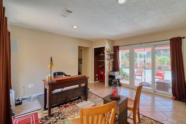 16322 Clearcrest Dr, Houston, TX 77059 - office area featuring light tile patterned floors, french doors, recessed lighting, and a textured ceiling