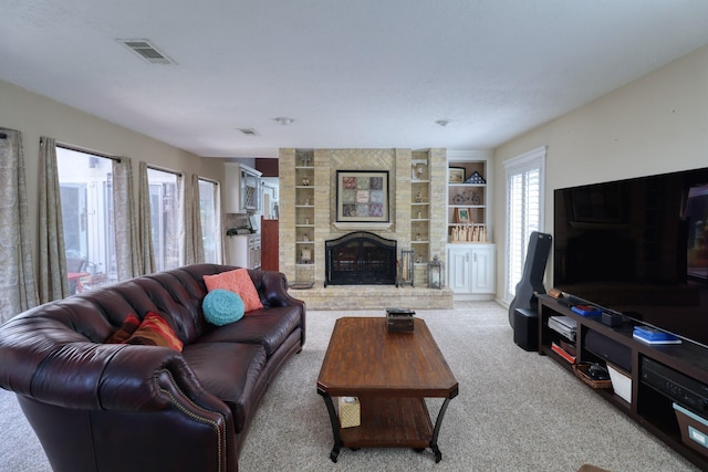 16322 Clearcrest Dr, Houston, TX 77059 - carpeted living room featuring a fireplace and built in shelves