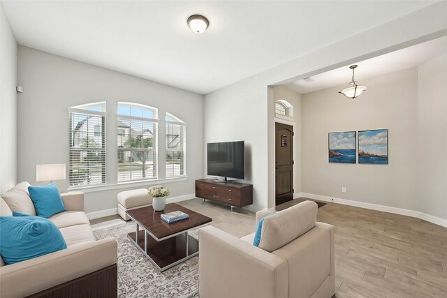 18314 Pedernales Springs Dr, Cypress, TX 77433 - living area featuring baseboards and light wood-style flooring