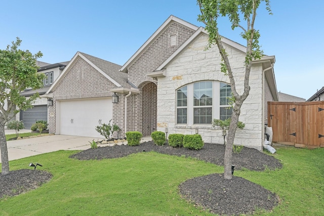 18314 Pedernales Springs Dr, Cypress, TX 77433 - view of front of home with stone siding, a garage, and concrete driveway