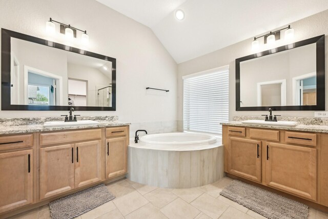 18314 Pedernales Springs Dr, Cypress, TX 77433 - bathroom with vaulted ceiling, two vanities, a garden tub, an enclosed shower, and tile patterned floors
