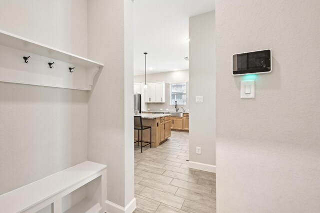 18314 Pedernales Springs Dr, Cypress, TX 77433 - mudroom with a sink and baseboards
