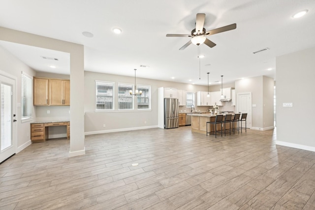 18314 Pedernales Springs Dr, Cypress, TX 77433 - living room featuring ceiling fan, light wood-type flooring, recessed lighting, and a chandelier