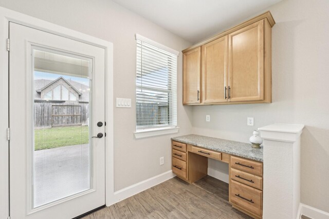18314 Pedernales Springs Dr, Cypress, TX 77433 - unfurnished office featuring built in study area and light wood-type flooring